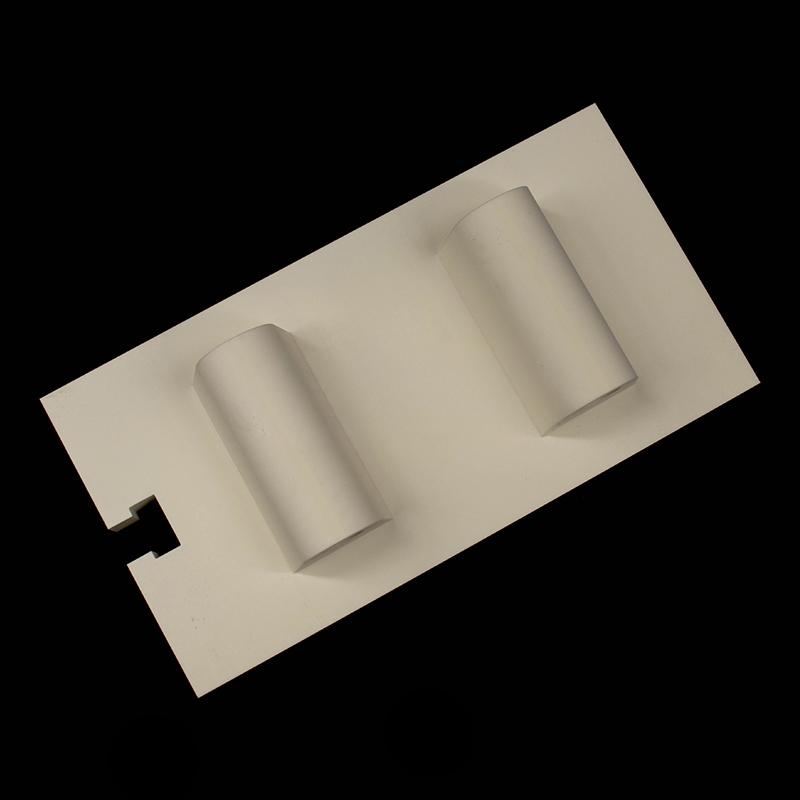 Aluminum oxide ceramic shaped part with a central protrusion and hole