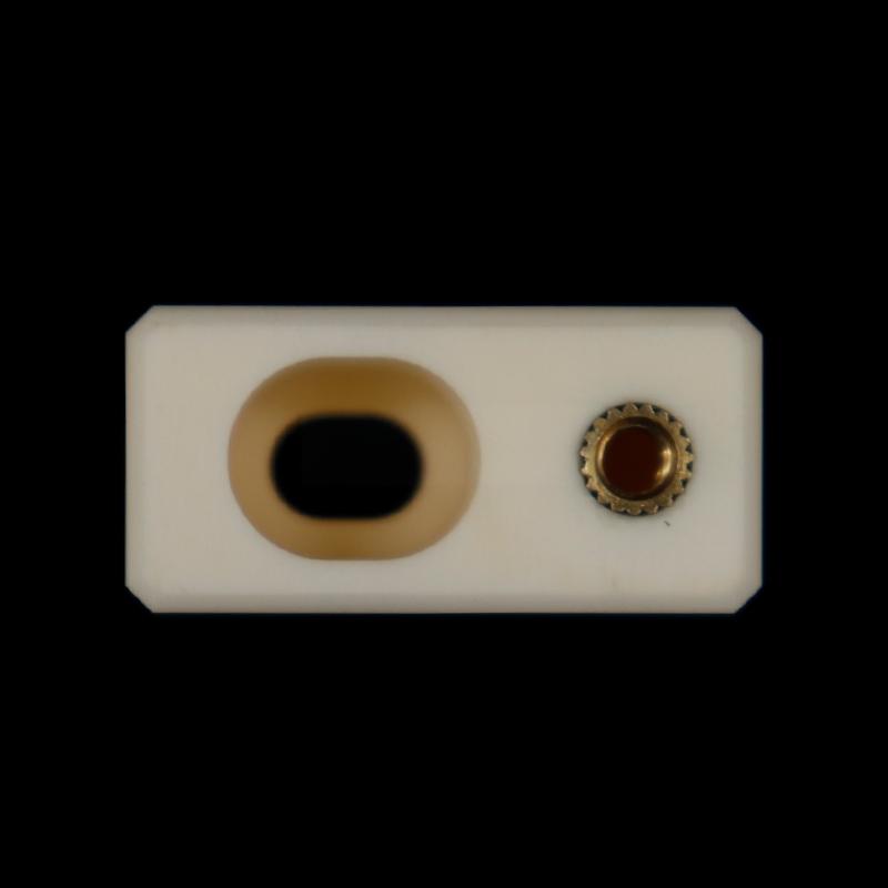Aluminum oxide ceramic structural component with circular grooves and threaded holes inside the rectangular body