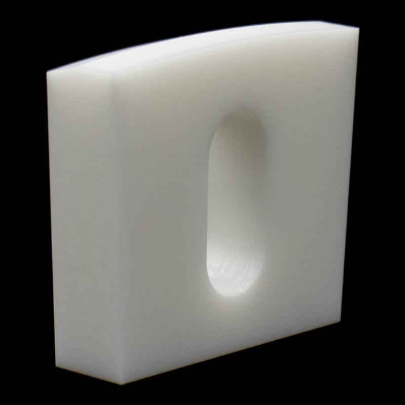 Elliptical through-hole square ceramic structural component
