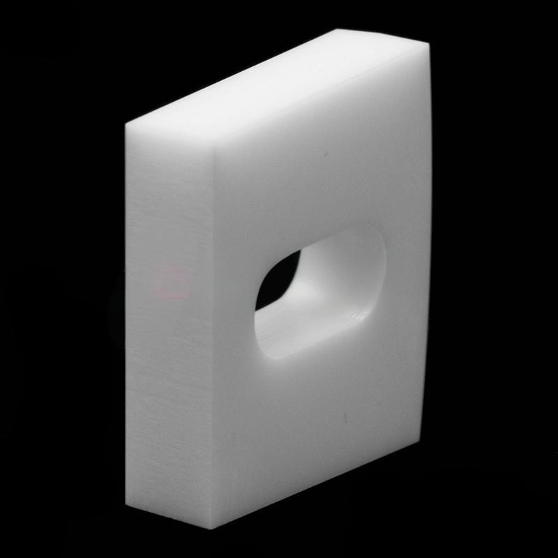 Elliptical through-hole square ceramic structural component